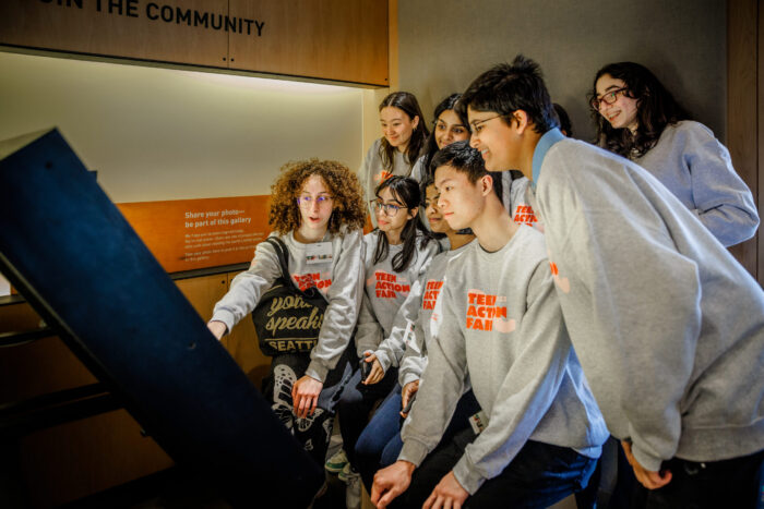 Group of youth posing for a photo together in the Discovery Center photo booth