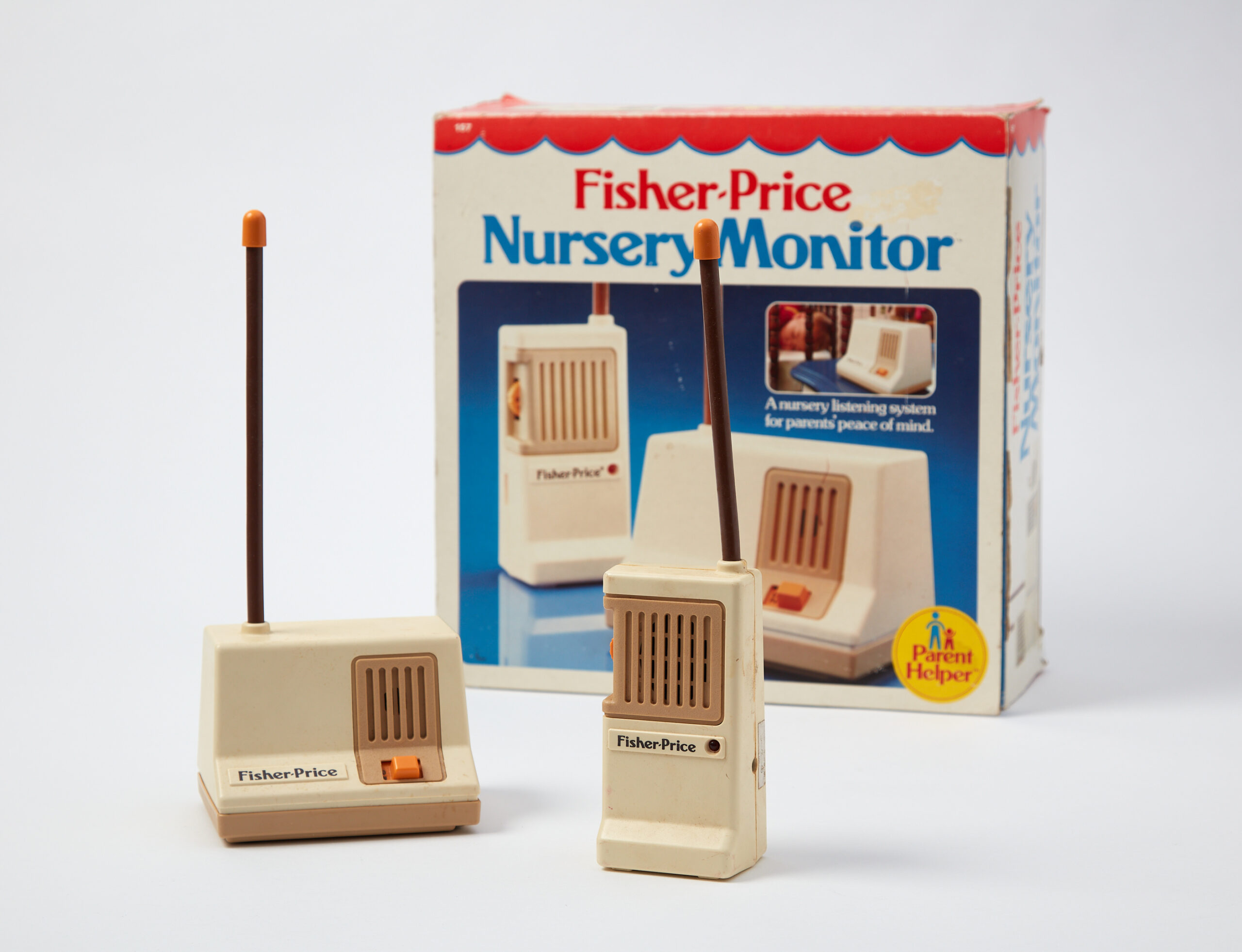 Image of a 183 baby monitor set and original box by Fisher-Price on a white background