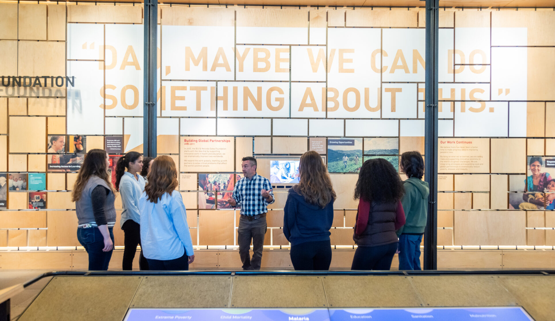 Visitors on a gallery tour with staff at the Gates Foundation Discovery Center.