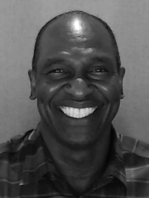 Black and white headshot image of Discovery Center staff member David McIntosh.