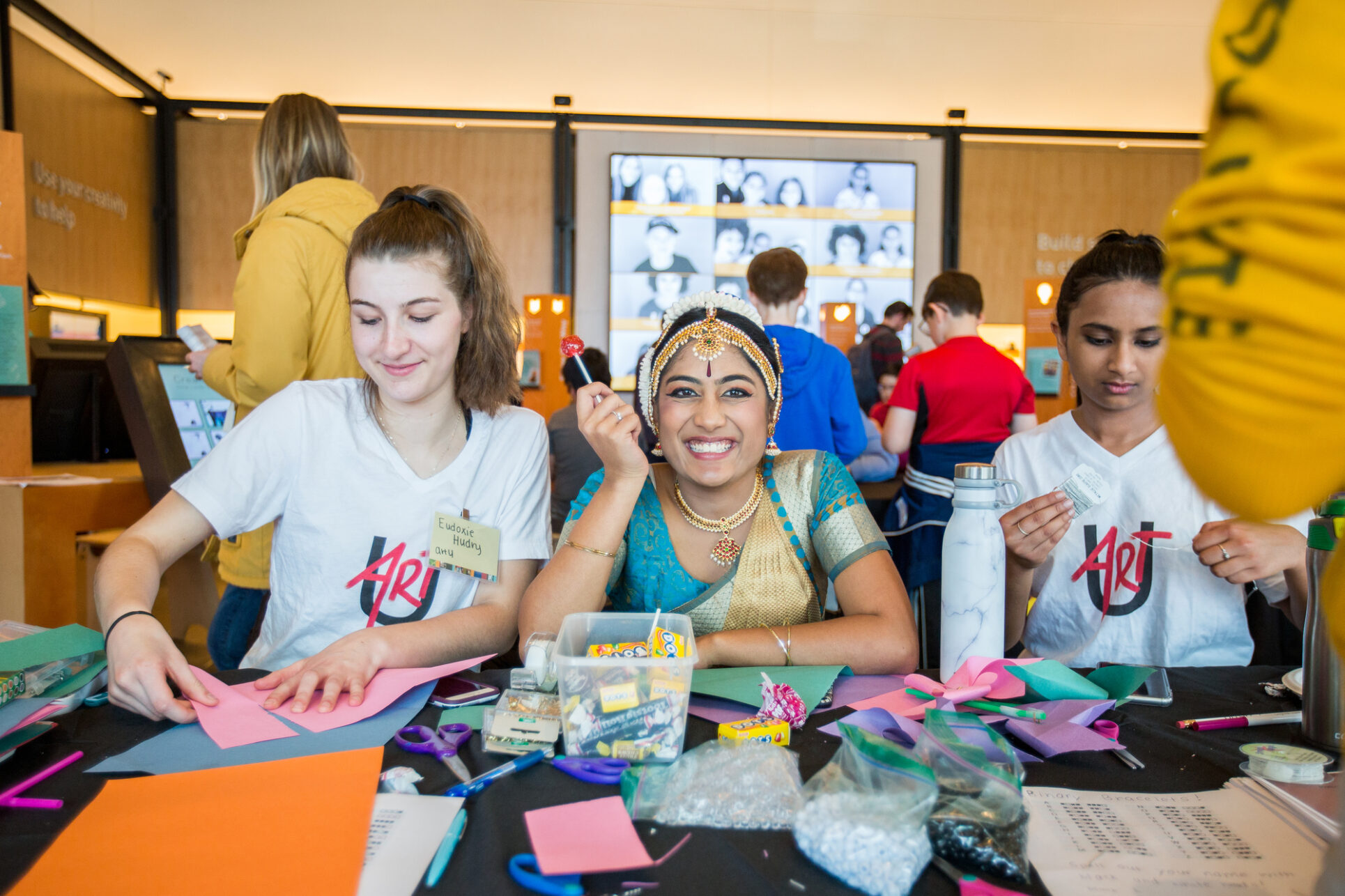 Teens with Art You working on an art project and smiling for the camera