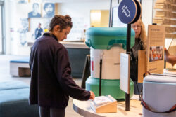 Visitors interact with Welcome gallery installations.