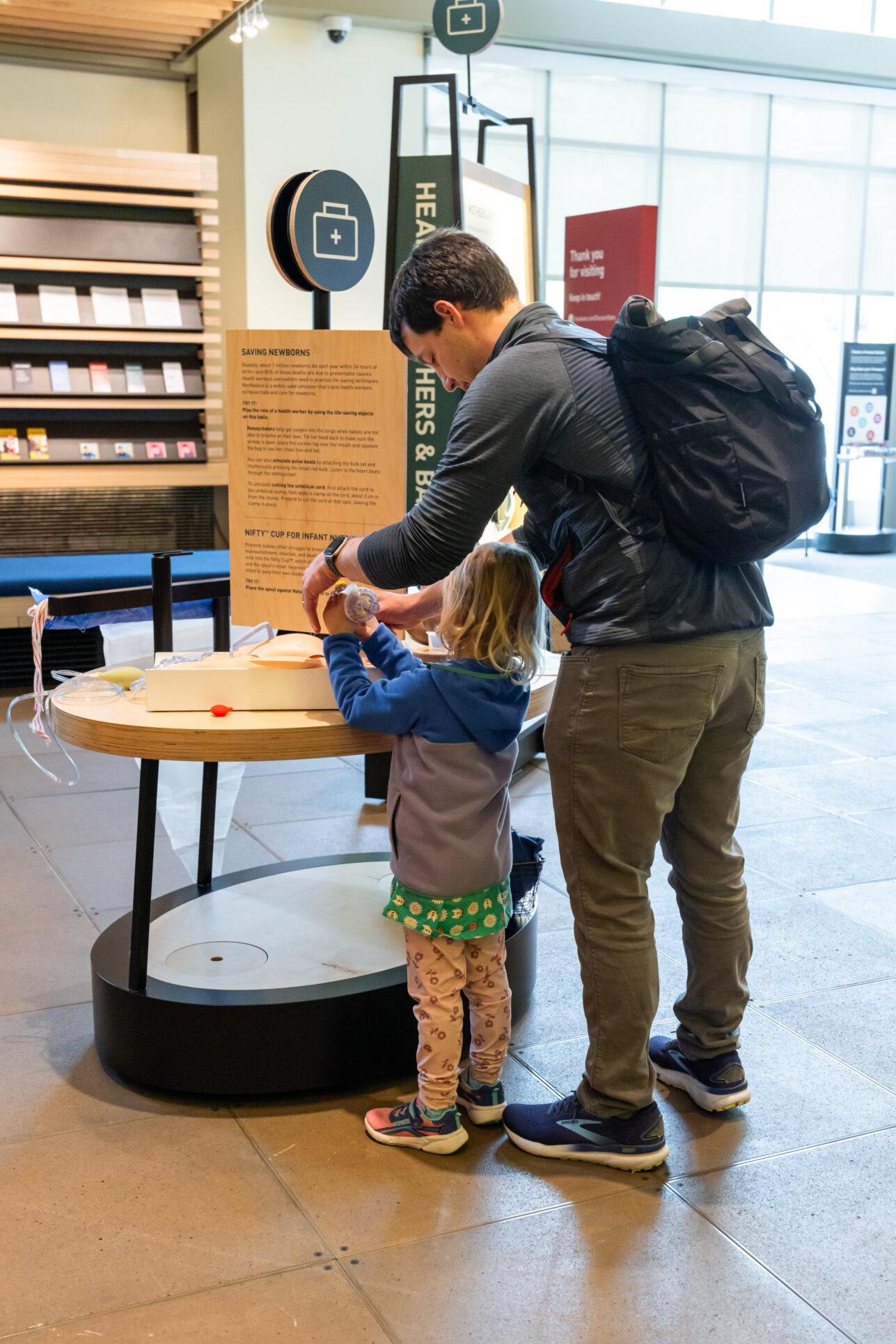 Visitors interact with Welcome gallery installations.