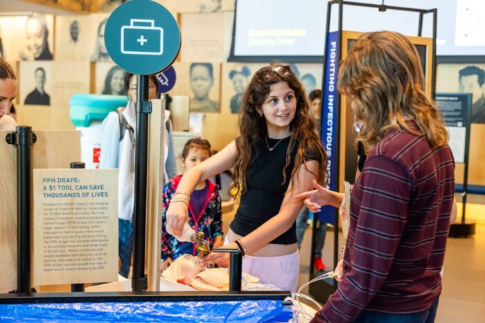 Visitors interact with Welcome gallery installations.