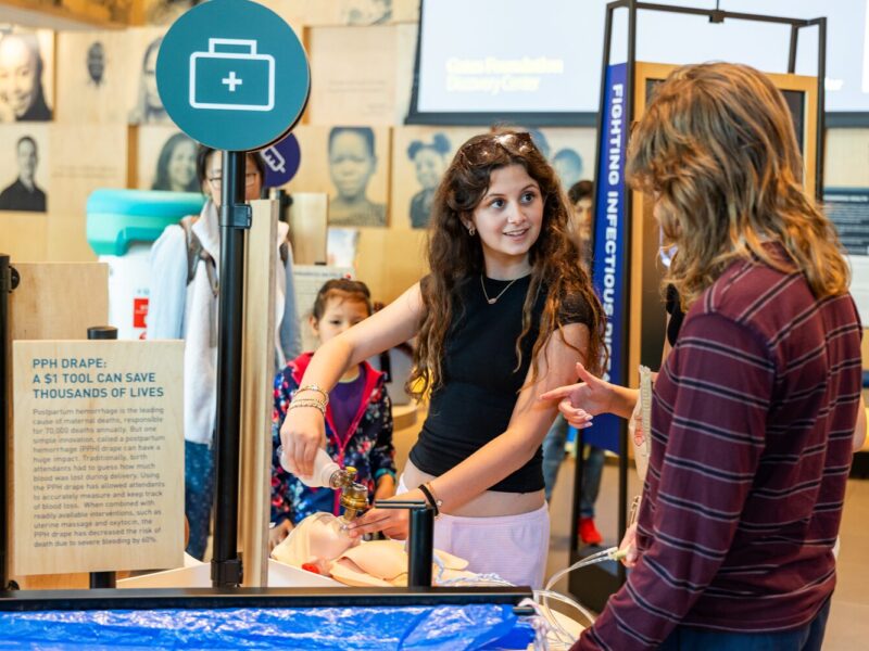 Visitors interact with Welcome gallery installations.