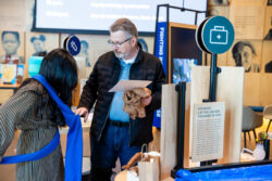 Visitors interact with Welcome gallery installations.