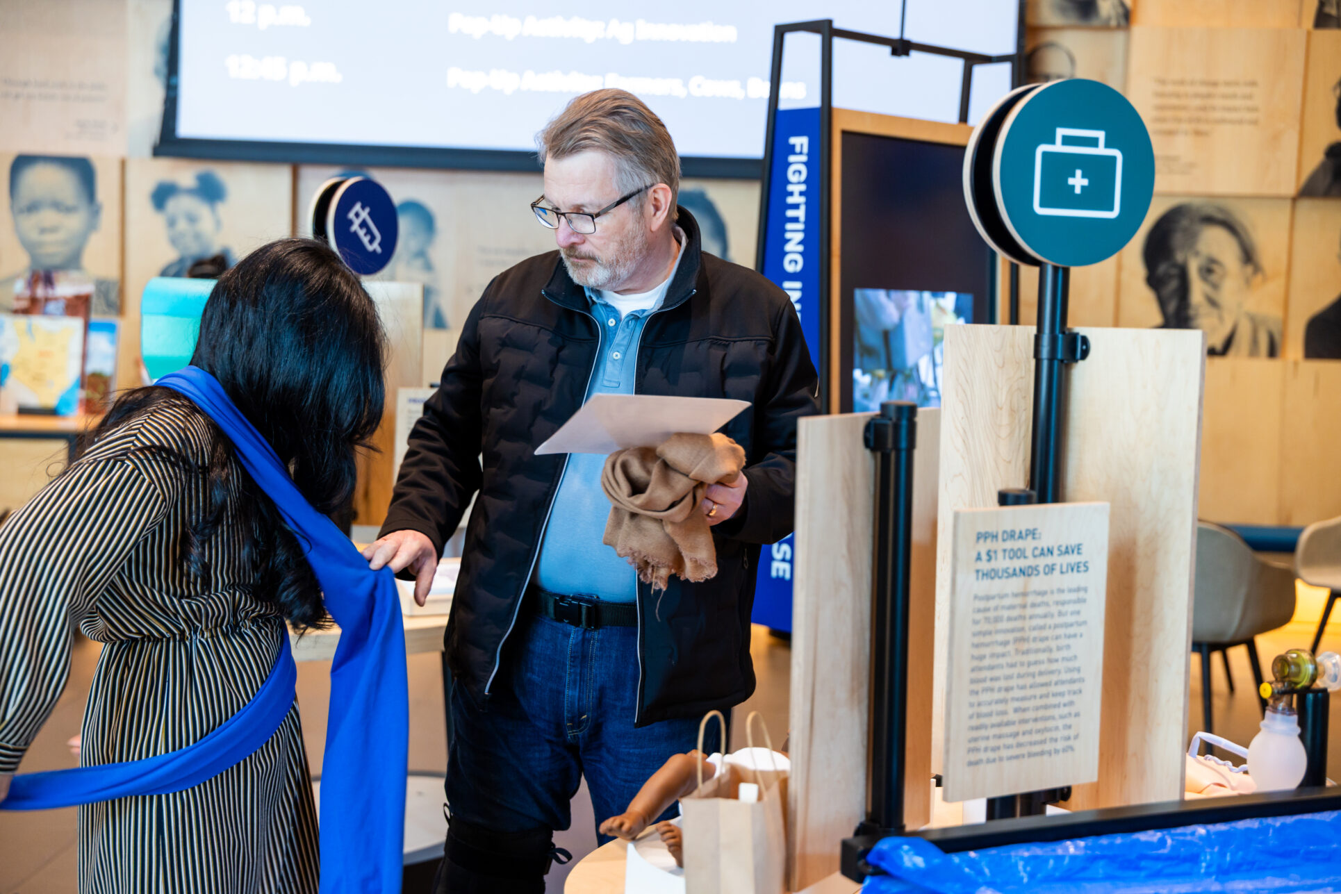 Visitors interact with Welcome gallery installations.