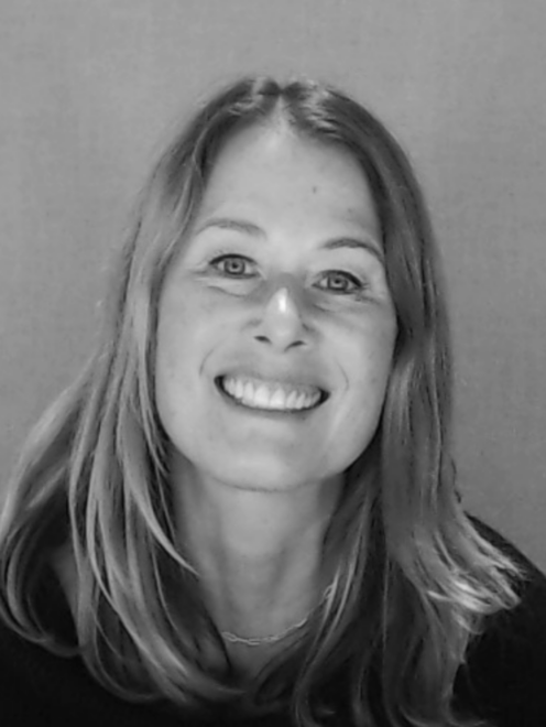 Black and white headshot image of Discovery Center staff member Cara Egan.