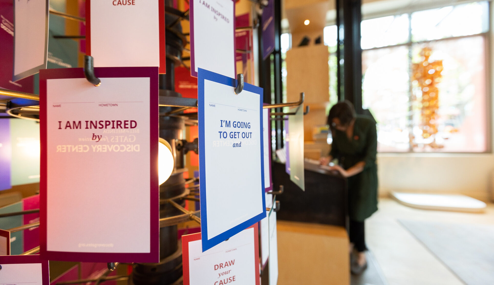 Close up of the share your cause rack in the Discovery Center. Visitors can personalize a card and hang on the rack during their visit.