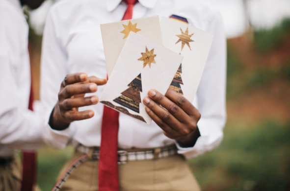 Hands holding handmade holiday cards