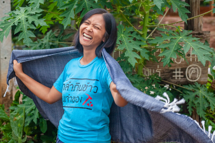 Woman smiling with wrap around shoulders