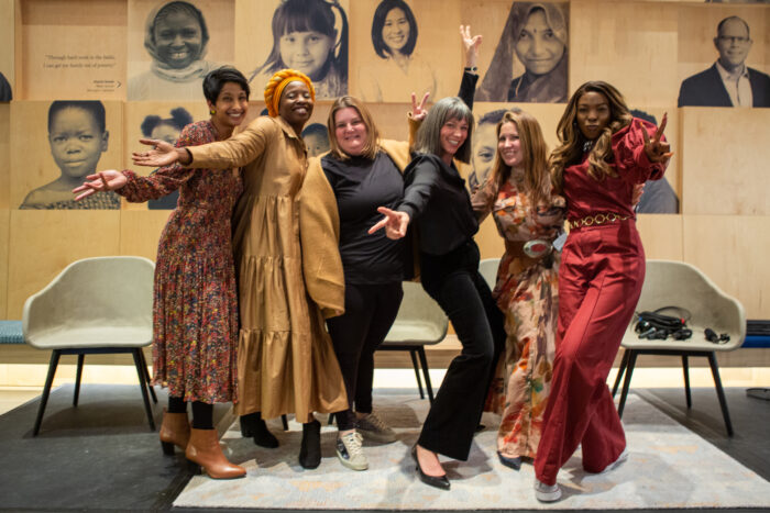 Hema Magge, MD, MS Senior Program Officer, Newborn Health on the Maternal, Newborn, and Child health team at the Bill & Melinda Gates Foundation (left) poses together with the Moth storytellers at the International Women's Day: Stories of Redefining Motherhood celebration at the Bill and Melinda Gates Foundation Discovery Center.