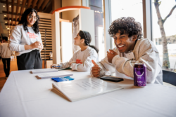 Youth Ambassadors laughing together during Teen Action Fair 2023.