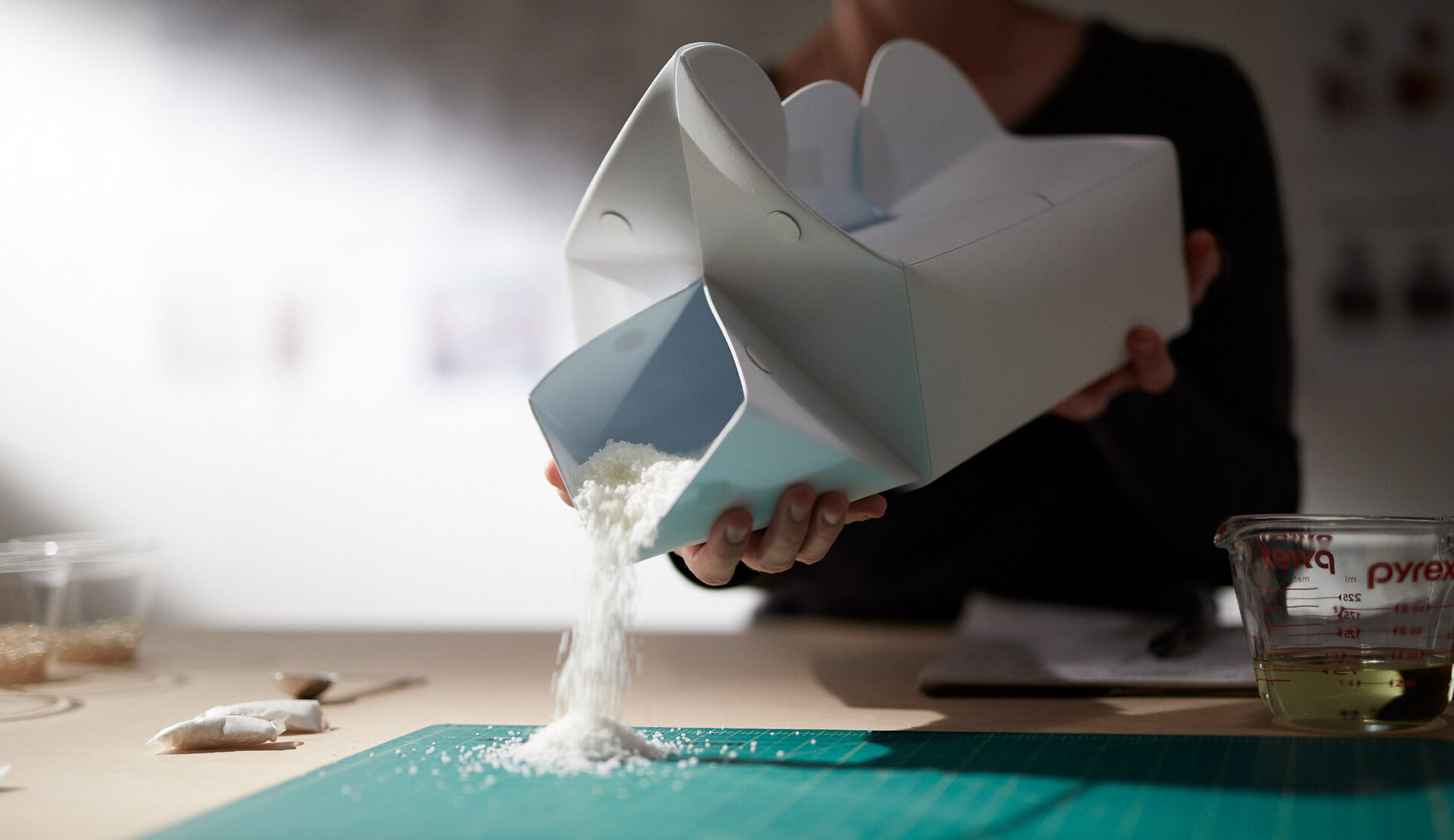 the night loo box powder being poured out onto a table.