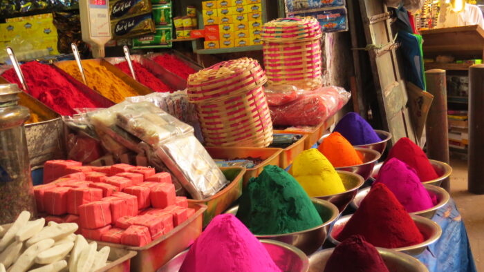Amrita Seattle vendor table to brightly colored wares