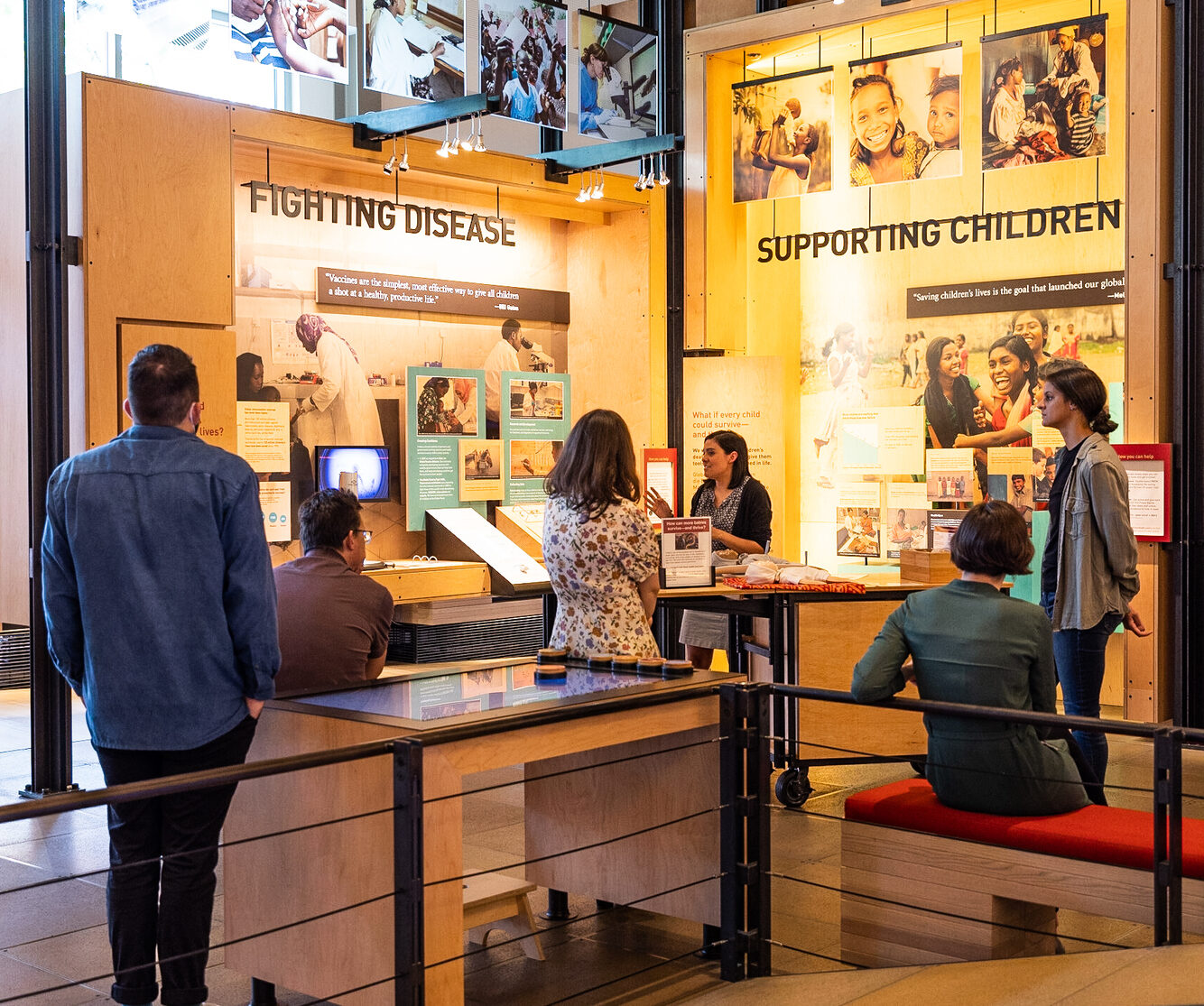 Visitors listen to a speaker during a guided tour at the Gates Foundation Discovery Center.