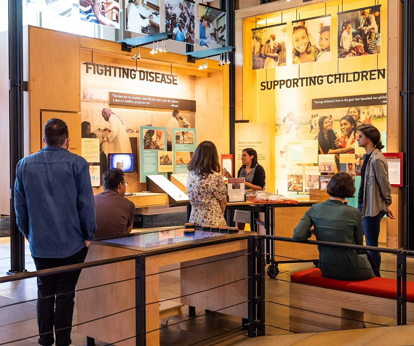 Visitors listen to a speaker during a guided tour at the Gates Foundation Discovery Center.