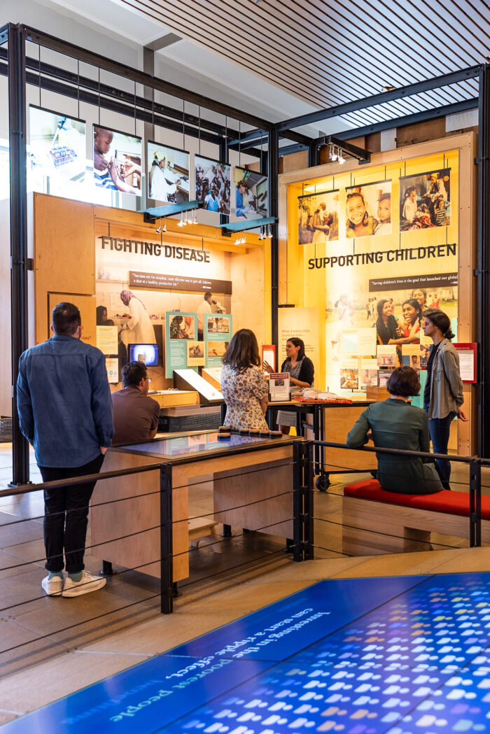 Visitors listen to a speaker during a guided tour at the Gates Foundation Discovery Center.