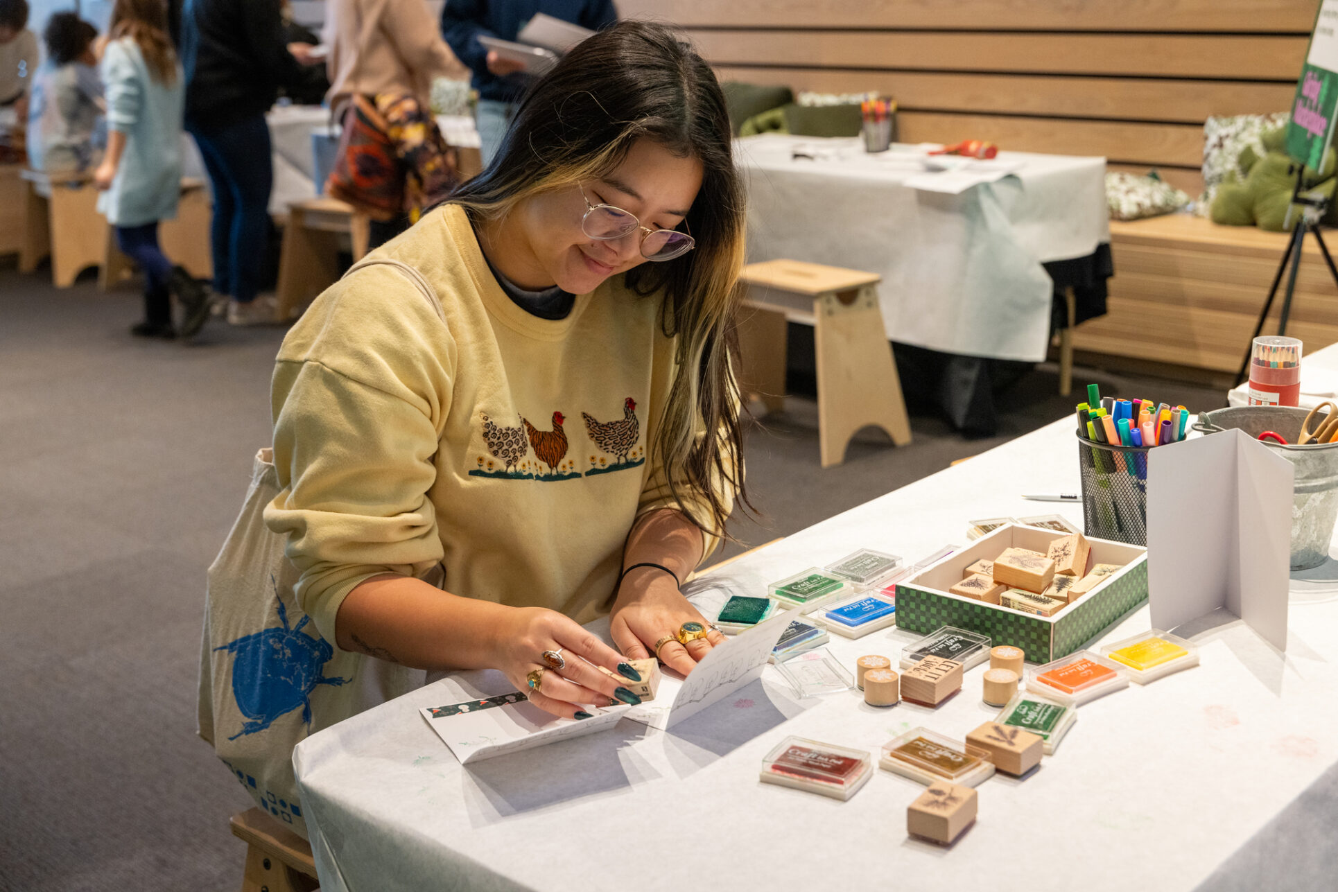 Visitor enjoys a card making activity.
