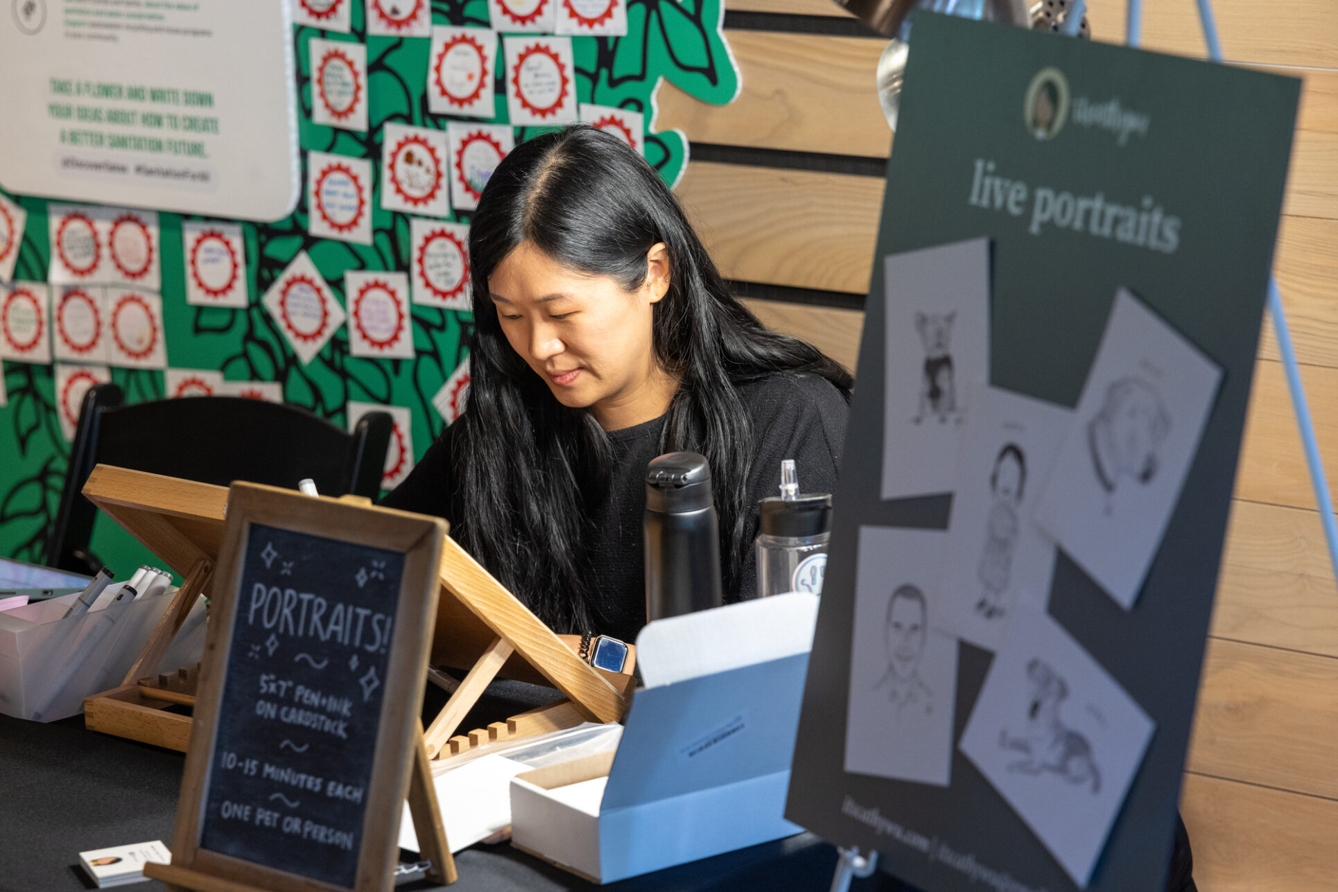 Cathy Wu works on portraits