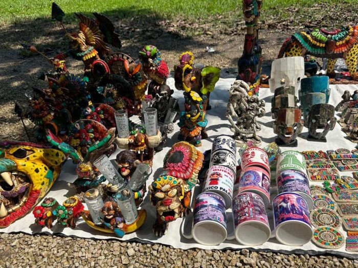 various goods on display outdoors on a white sheet