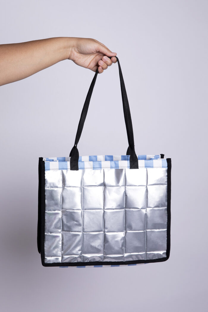 Silver tote bag on a grey background