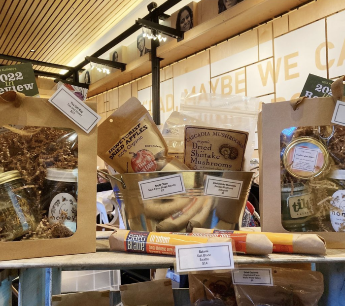 Tilth products on display in kraft paper packaging.