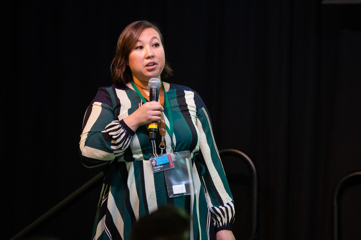 Heather Yang Hwalek speaks during the IGNITE employee storytelling session.