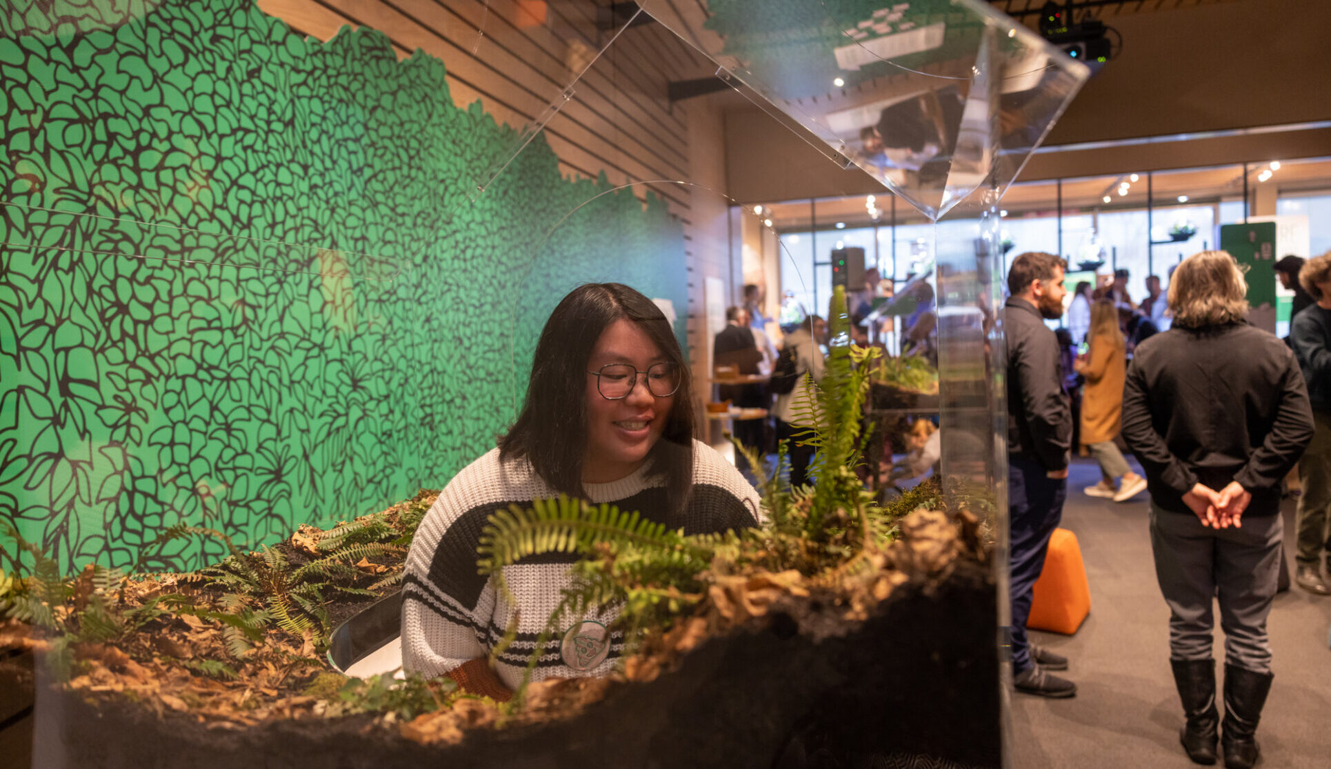 Visitors enjoy the environmental artist Vaughn Bell’s installation “Village Green: Loopscapes, 2024”