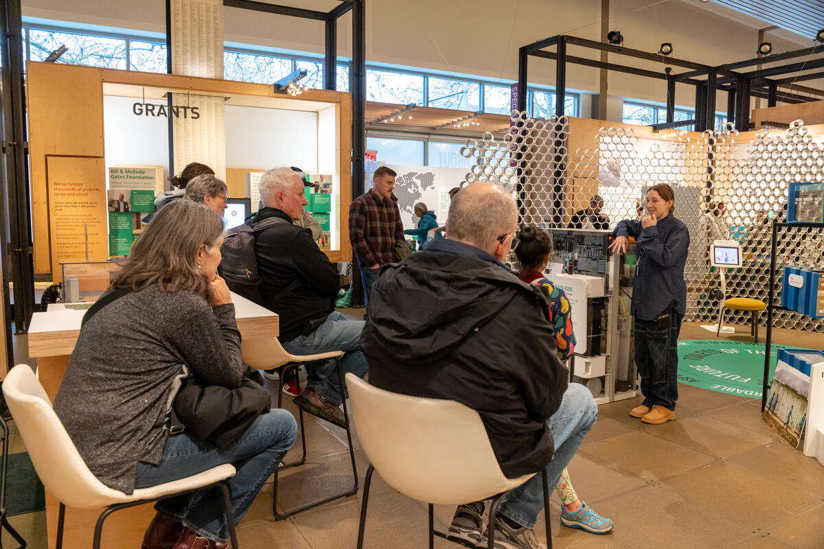 Visitors remain seated during a stationary tour of the Discovery Center galleries.
