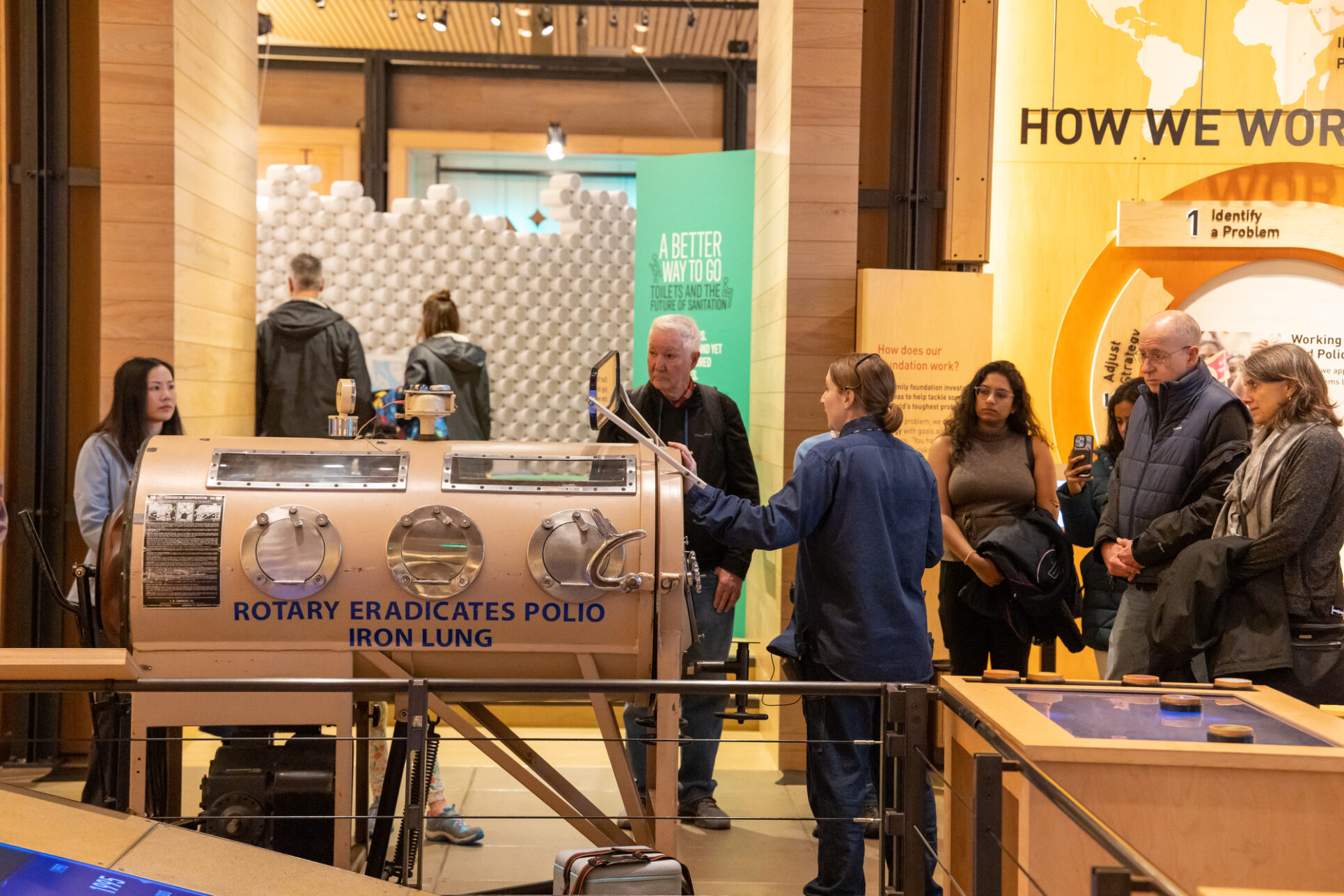 Visitors hear about the iron lung device on view in the Discovery Center.